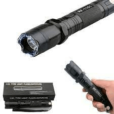 Black handheld electric shock flashlight with LED light head, textured grip, and product packaging shown on a white background.