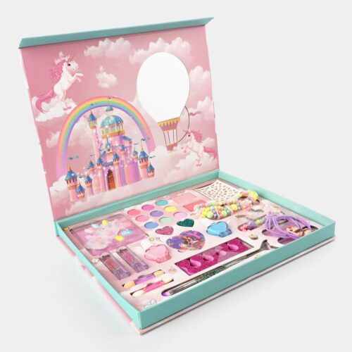 Open kids pretend makeup kit in a pink and teal box featuring a magical castle and unicorn illustration, displaying eyeshadows, lipsticks, nail art, and jewelry.