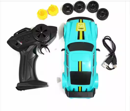 Packaging box for a Ready to Race Drift RC 4WD Remote Control Car. The box displays a teal toy car with black and yellow racing stripes and a black spoiler, alongside a pistol-grip 2.4GHz remote control. Icons on the left side of the box indicate the car features 2.4GHz RC, Light, Sound, Drift Tyres, and is intended for ages 6+