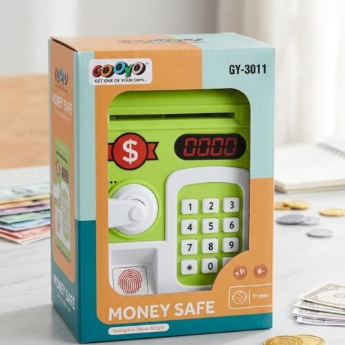 A bright green and white Fingerprint Money Safe electronic piggy bank toy displayed next to its retail packaging. The toy features a top coin slot, a paper money slot, a keypad, a red digital display, a turn-knob, and a simulated fingerprint scanner.