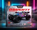 Retail packaging box for the ENOZE DOUGHTY RC Racing Series car, featuring an action shot of a blue, white, and purple 1:16 scale off-road buggy. The box graphics highlight key specifications including a top speed of 45 KM/H, a 4WD system, 2.4G frequency, and an age 14+ recommendation alongside the bold text "Challenge EXTREMES".