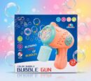 Retail packaging box for the CooCoo Color Bubble Gun. The blue box displays a pink and teal automatic bubble maker surrounded by floating bubbles, highlighting key features like Type-C charging, Light, Music, "Blowing lots of bubbles," and an age 3+ rating.