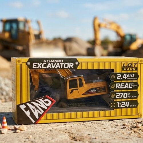 A young boy sitting outdoors in the dirt, operating a yellow and black remote control excavator toy. The toy excavator is actively scooping up loose gravel with its bucket, surrounded by miniature orange safety cones and a yellow caution sign on the ground.