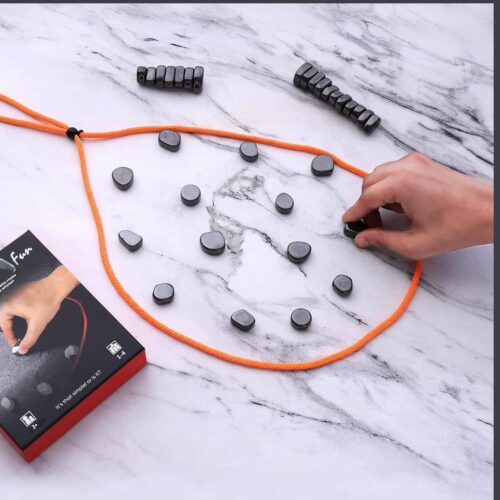 Black retail box for the Ramaya MAG Fun magnetic game featuring an illustration of shiny, irregular magnetic stones and a blue string, with an "Ages 4+" rating and a "SCAN ME! How to Play" QR code printed on the front.