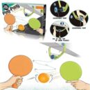 Retail packaging and demonstration graphics for the Sport Series hanging ping pong set. The graphics show a green clamp fixed to a door frame suspending an orange ball on a string, alongside a three-step instruction guide for adjusting the string length, and two hands holding orange and green paddles ready to hit the ball.