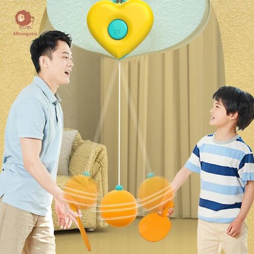 Retail packaging and demonstration graphics for the Sport Series hanging ping pong set. The graphics show a green clamp fixed to a door frame suspending an orange ball on a string, alongside a three-step instruction guide for adjusting the string length, and two hands holding orange and green paddles ready to hit the ball.