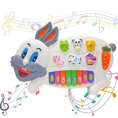 A white plastic musical toy shaped like a rabbit, featuring 8 colorful piano keys along the bottom, a carrot-shaped mode key, and six interactive character buttons shaped like a child, frog, sheep, cow, dog, and duck. Text at the top reads "RABBIT PIANO - Safe & Healthy Materials".